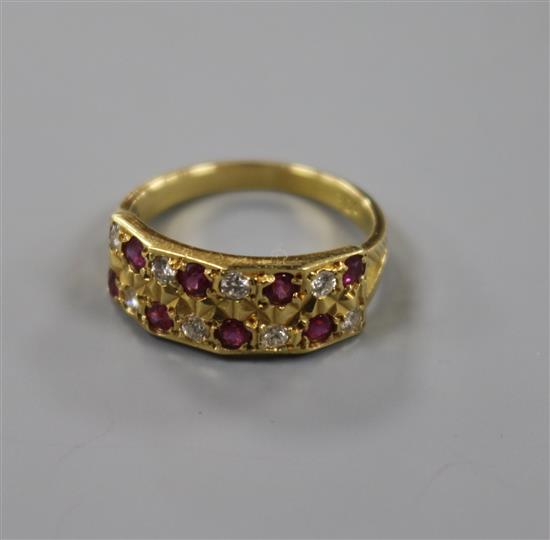 A modern 18ct gold and twin row ruby and diamond half hoop ring, size M.